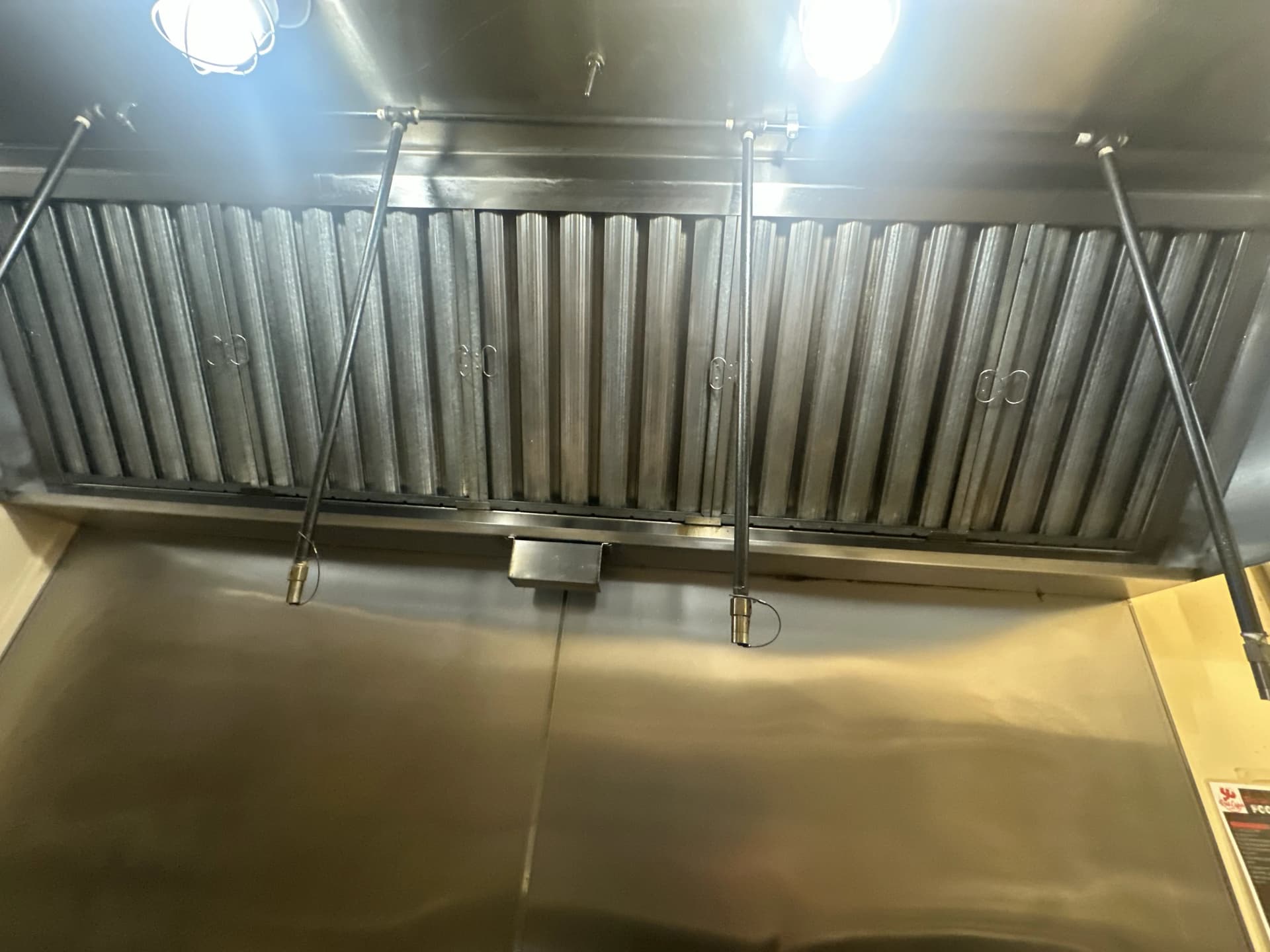 Grease filters viewed from below — after professional cleaning