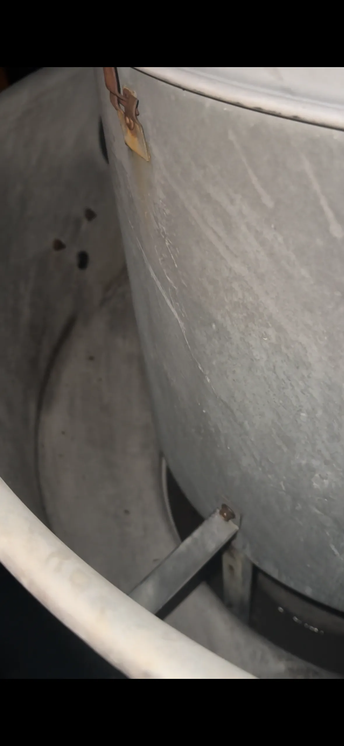 Dirty grease-covered roof exhaust fan housing — before cleaning